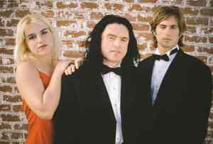 Juliette Danielle, Tommy Wiseau, and Greg Sestero in The Room