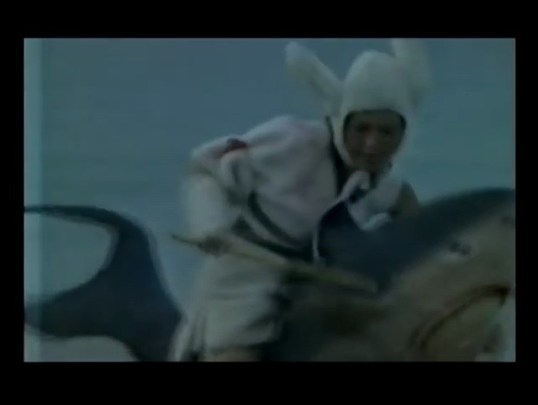 Right now a woman is riding a shark while wearing a bunny suit. (Zodiac Fighters, 1978)